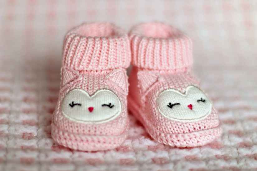 close up of pink baby booties